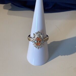 Elegant Silver and Gold Ring with Orange Gemstone